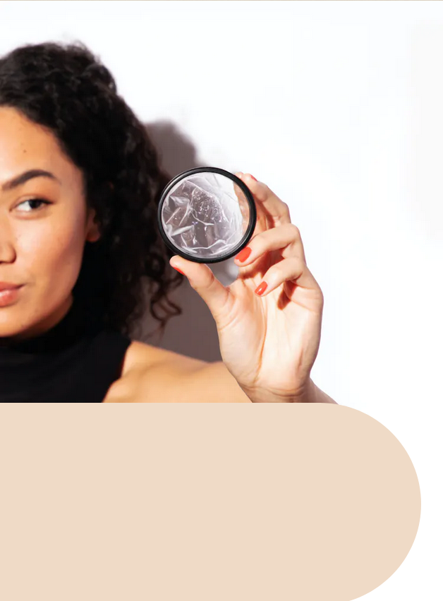 Woman holding up a Flex Disc