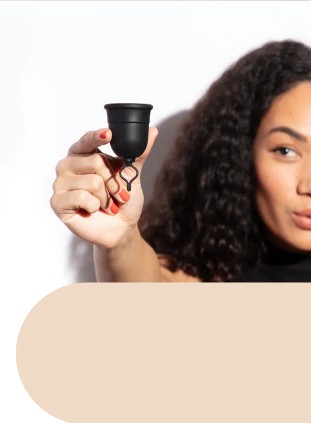 Woman holding up a Flex Cup