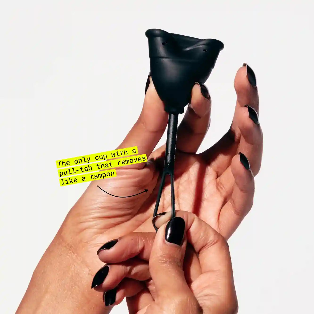 Hand holding menstrual cup with pull-tab stem for tampon-like removal