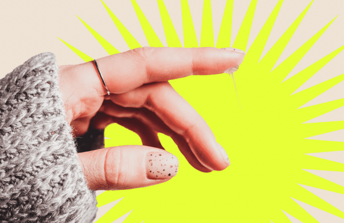 a womans finger with vaginal discharge on it