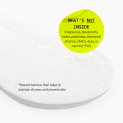 Close-up of a menstrual liner with text indicating absence of certain chemicals and use of bamboo fiber.
