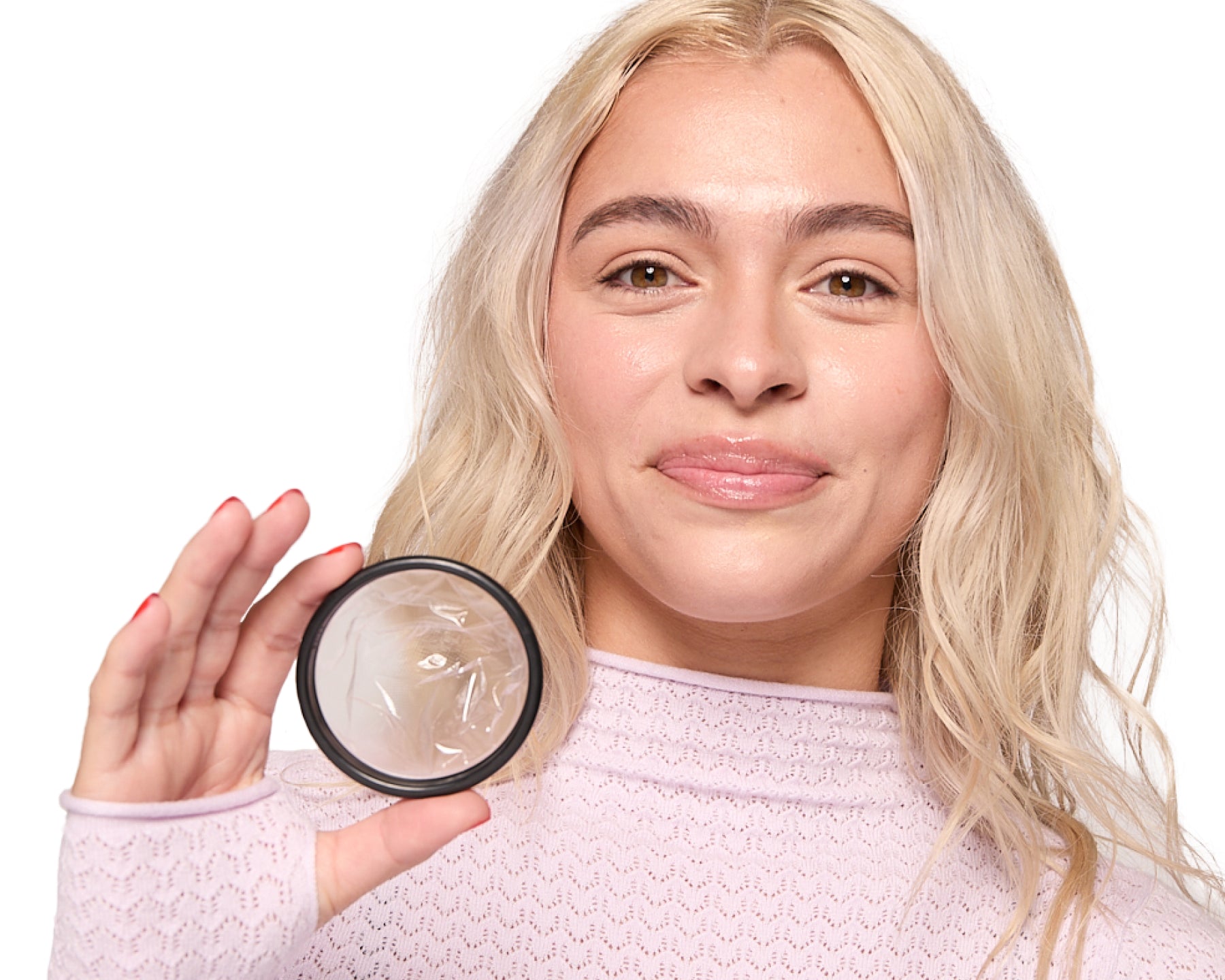 person-holding-menstrual-disc-closeup.jpg
